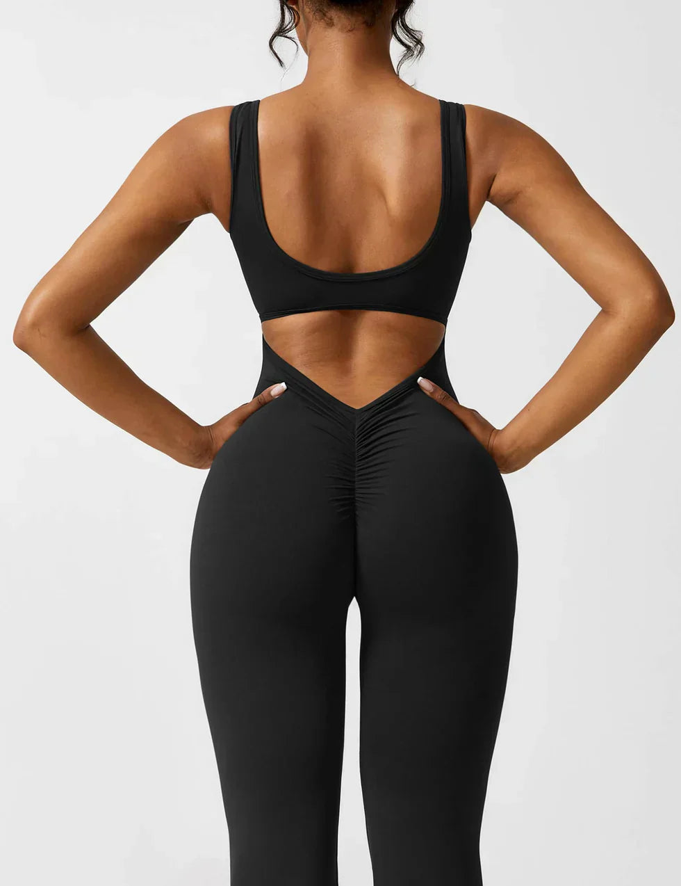 Elodie - Jumpsuit s rozšířenými nohavicemi a V-zadním výstřihem
